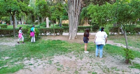 Blindfold game at the National Garden of Athens, mothers guided by daughters.