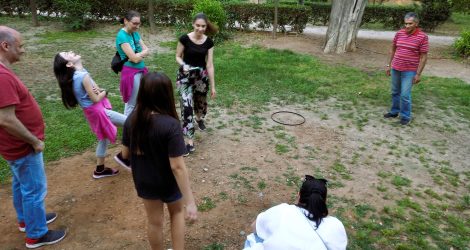 Family target game in Athens, children laughing while playing.